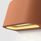 The light source of the Mast Twin Coastal Outdoor Wall Sconce by Astro Lighting in terracotta concrete.