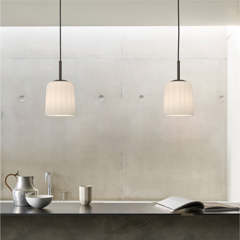 The small Veo Pendant from Astro Lighting in a dining and kitchen space.