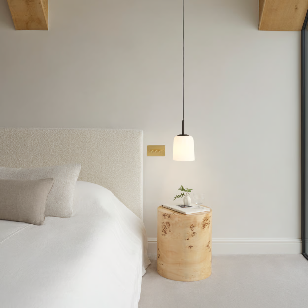 The small Veo Pendant from Astro Lighting in a guest bedroom.