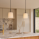 The small Veo Pendant from Astro Lighting above a kitchen island.