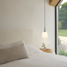 The small Veo Pendant from Astro Lighting in a primary bedroom.