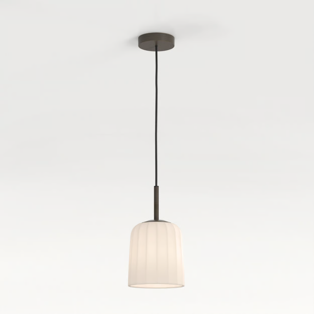 The small Veo Pendant from Astro Lighting in a studio.