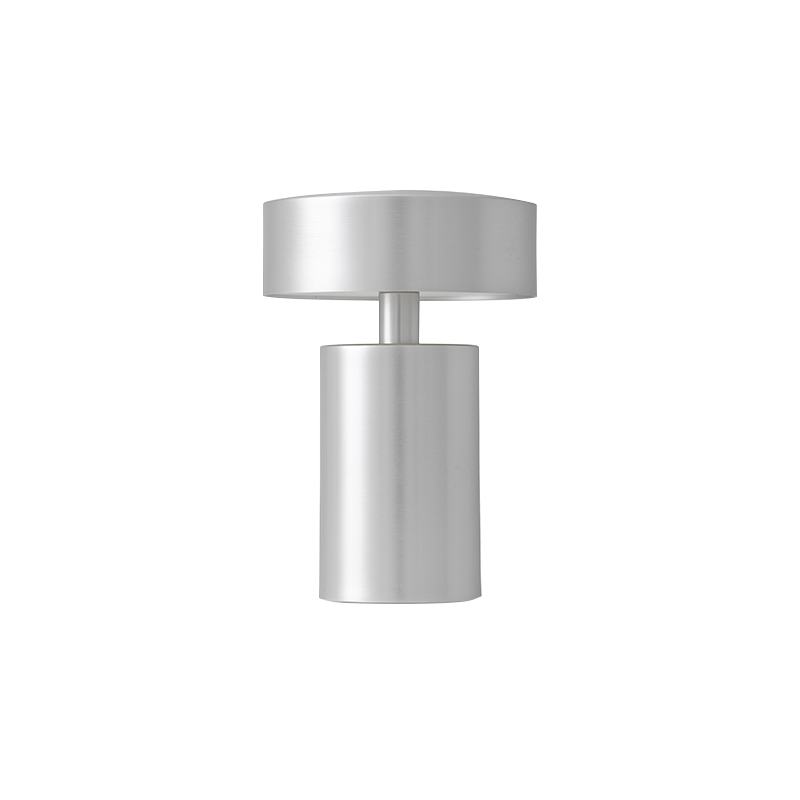 The Column Portable Table Lamp from Audo Copenhagen in brushed aluminum.