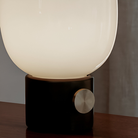The JWDA Portable Table Lamp from Audo Copenhagen in black in a close-up.