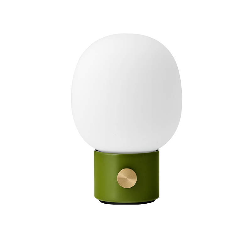 The JWDA Portable Table Lamp from Audo Copenhagen in dusty green.