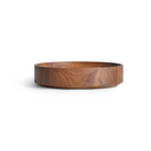 The Cusp Small Bowl from Blu Dot in walnut from an angle.