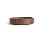 The Cusp Small Bowl from Blu Dot in walnut from the side.