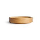 The Cusp Small Bowl from Blu Dot in white oak from the side.