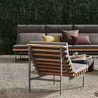 The toohey charcoal Perch Outdoor 3 and 1 Seat Sofa with charcoal frame from Bludot on patio. all-groups