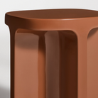 The rust Small Talk Side Table from Bludot with edge close up.