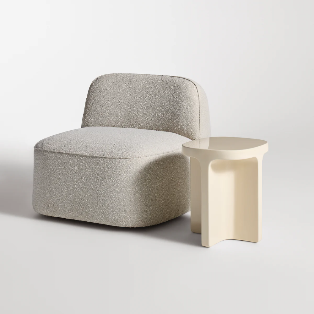 The ivory Small Talk Tall Side Table from bludot with looksee swivel lounge chair in studio.