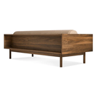 The Souvenir Sofa from Blu Dot with the irving copper stripe upholstery and walnut frame from the back at an angle.