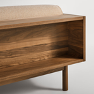 The Souvenir Sofa from Blu Dot with the irving copper stripe upholstery and walnut frame from the back in detail.