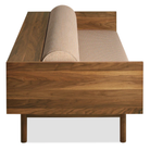 The Souvenir Sofa from Blu Dot with the irving copper stripe upholstery and walnut frame from the side at an angle.