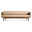 The Souvenir Sofa from Blu Dot with the irving copper stripe upholstery and walnut frame.