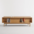 The Souvenir Sofa from Blu Dot with the irving copper stripe upholstery and white oak frame from the back.