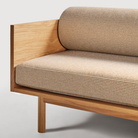 The Souvenir Sofa from Blu Dot with the irving copper stripe upholstery and white oak frame close up.