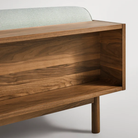 The Souvenir Sofa from Blu Dot with the irving gray blue stripe upholstery and walnut frame showing the back in detail.