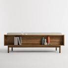 The Souvenir Sofa from Blu Dot with the irving gray blue stripe upholstery and walnut frame from the back.