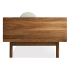 The Souvenir Sofa from Blu Dot with the irving gray blue stripe upholstery and walnut frame from the side.