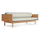 The Souvenir Sofa from Blu Dot with the irving gray blue stripe upholstery and white oak frame from an angle.