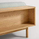 The Souvenir Sofa from Blu Dot with the irving gray blue stripe upholstery and white oak frame showing the back in detail.