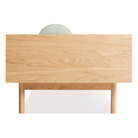 The Souvenir Sofa from Blu Dot with the irving gray blue stripe upholstery and white oak frame from the side.