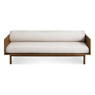 The Souvenir Sofa from Blu Dot with the landa stone upholstery and walnut frame from the front at an angle.