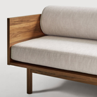 The Souvenir Sofa from Blu Dot with the landa stone upholstery and walnut frame showing the seating in detail.