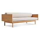 The Souvenir Sofa from Blu Dot with the landa stone upholstery and white oak frame at an angle.