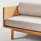 The Souvenir Sofa from Blu Dot with the landa stone upholstery and white oak frame close up.