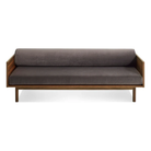 The Souvenir Sofa from Blu Dot with the storm velvet upholstery and walnut frame from the front at an angle.