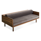 The Souvenir Sofa from Blu Dot with the storm velvet upholstery and walnut frame from a high angle.