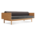 The Souvenir Sofa from Blu Dot with the storm velvet upholstery and white oak frame at an angle.