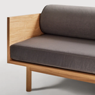The Souvenir Sofa from Blu Dot with the storm velvet upholstery and white oak frame close up.