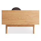 The Souvenir Sofa from Blu Dot with the storm velvet upholstery and white oak frame from the side.