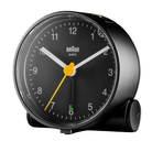 The black Round Alarm Clock BC01 by Braun from a side angle.