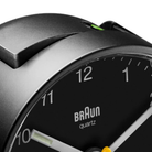 The black Round Alarm Clock BC01 by Braun from the top close-up.