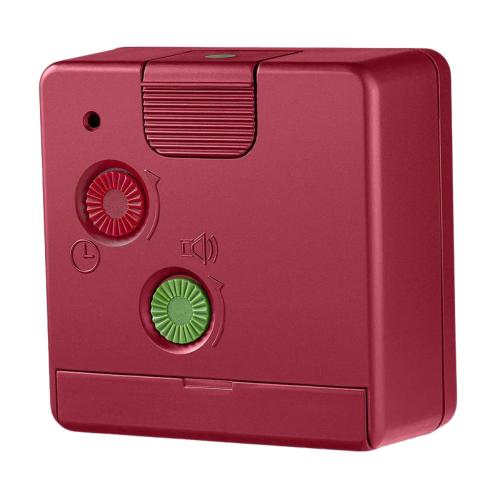 The red BC02 Travel Alarm Clock by Braun from the back.