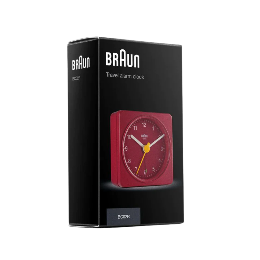 The red BC02 Travel Alarm Clock from Braun in the box.