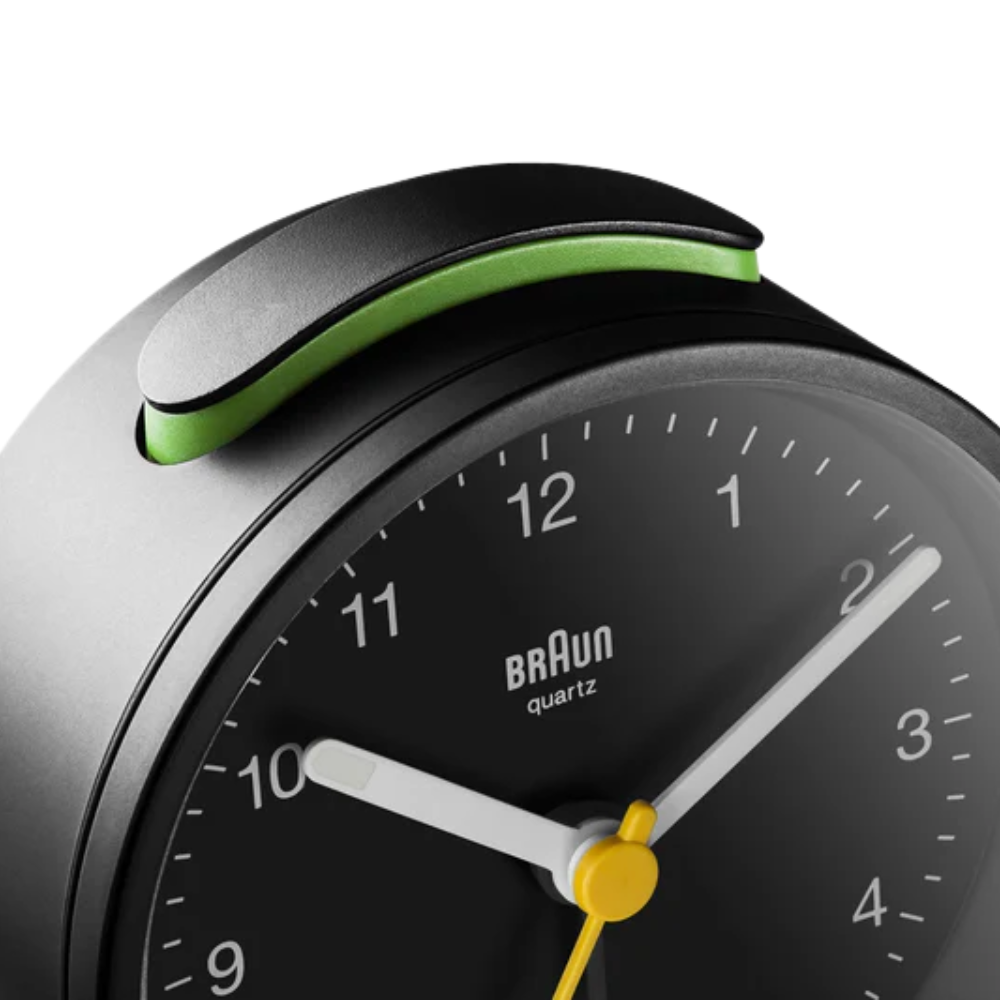 The black BC12 Round Alarm Clock by Braun from the top close-up.