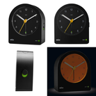 The black BC22 Alarm Clock from Braun with multiple views in a lifestyle image.