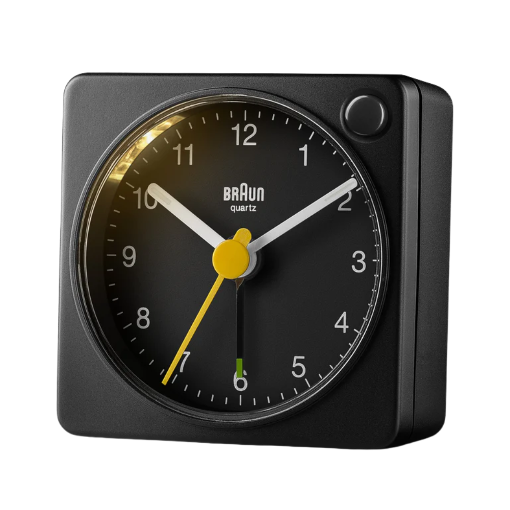 The black BC2X Travel Alarm Clock by Braun from the side.