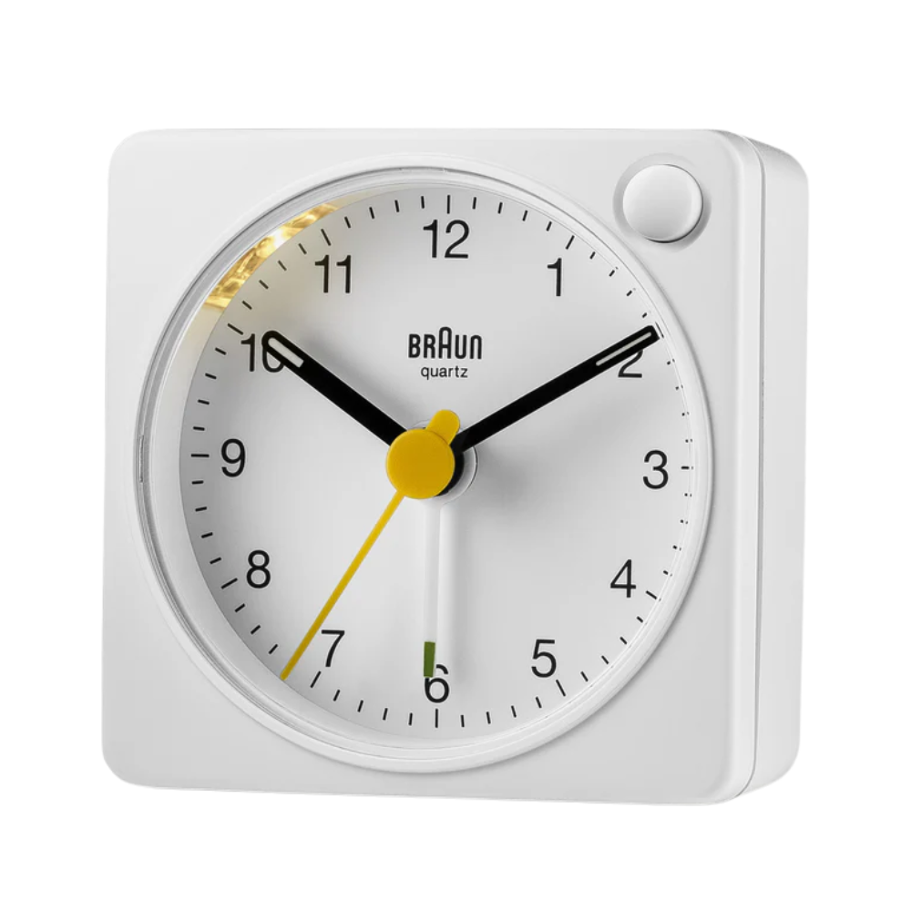 The white BC2X Travel Alarm Clock by Braun from the side.