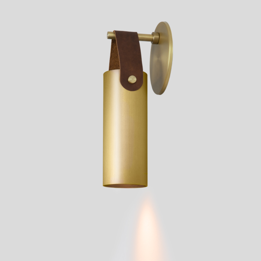 The brass and brown Spero Wall Sconce from Cerno from the side.