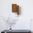 The Vesper Wall Sconce from Cerno in oiled walnut in a kids room.