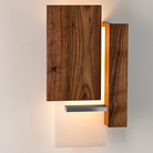 The Vesper Wall Sconce from Cerno in oiled walnut in a primary bedroom.