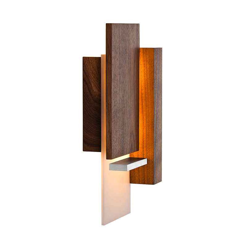 The Vesper Wall Sconce from Cerno in oiled walnut from the side.