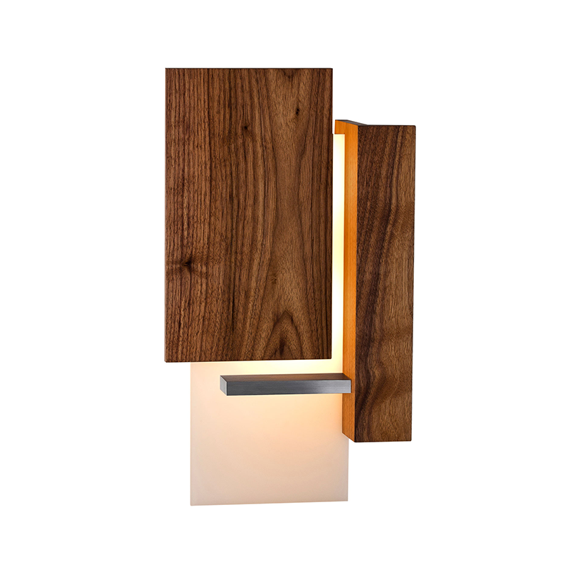 The Vesper Wall Sconce from Cerno in oiled walnut.