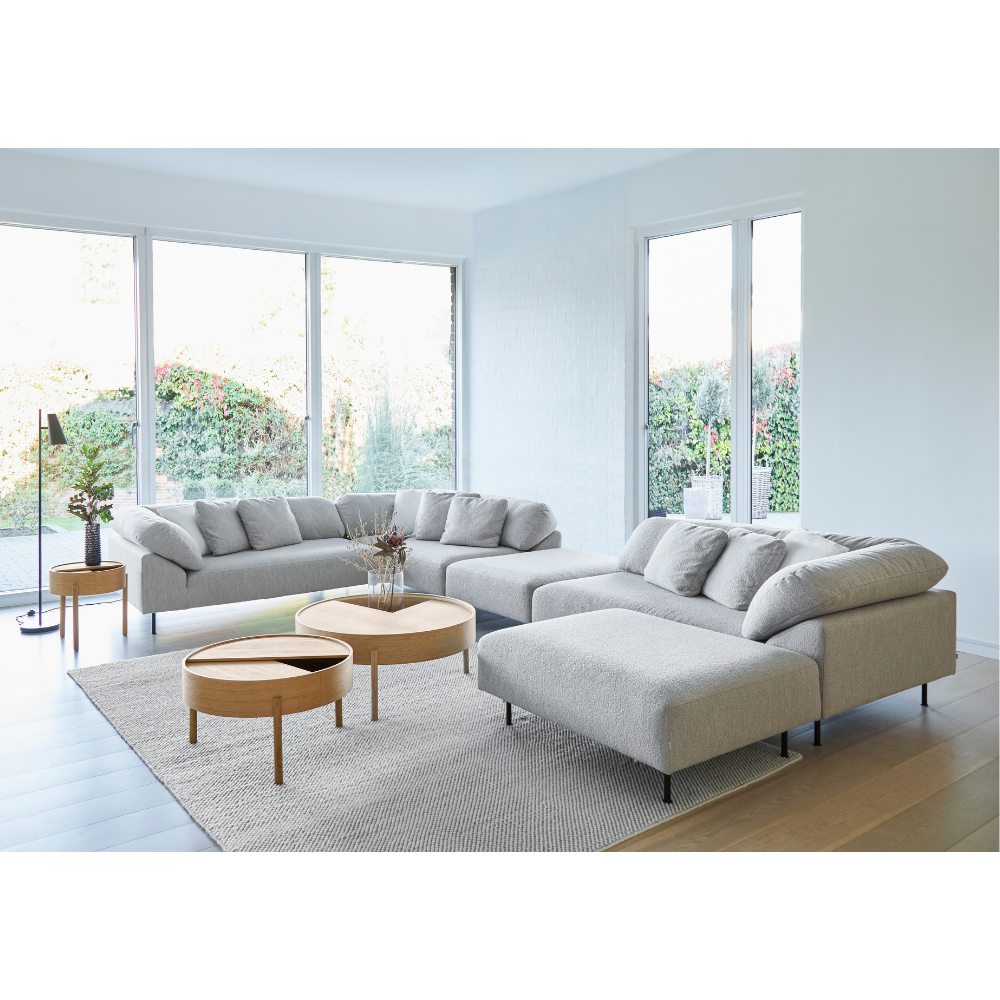 The Collar Open End configuration with Collar Ottoman in a living room. all-groups